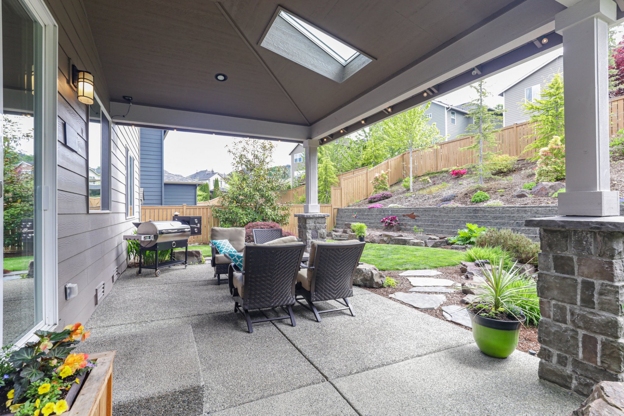 Covered patio with skylight to let the sunshine in. BBQ, rain or shine!